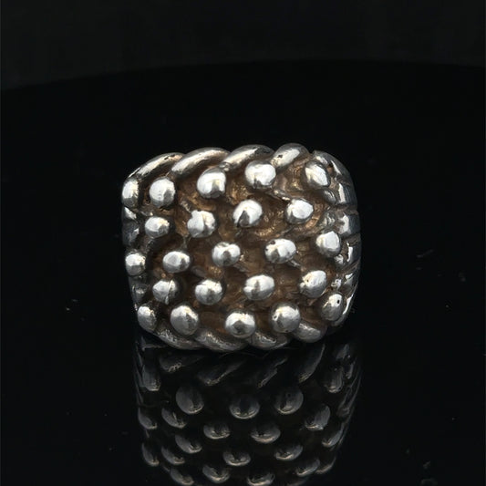 Silver keeper ring size Z1 by Reeves and Sons, showcasing a polished, detailed silver ring with intricate design.