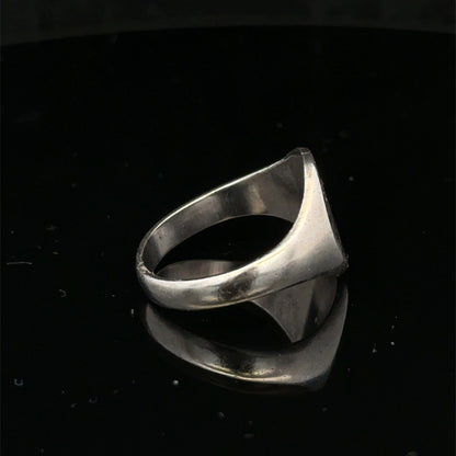 Silver signet ring with engraved face, size S1/2, by Reeves and Sons, displayed on a neutral background.