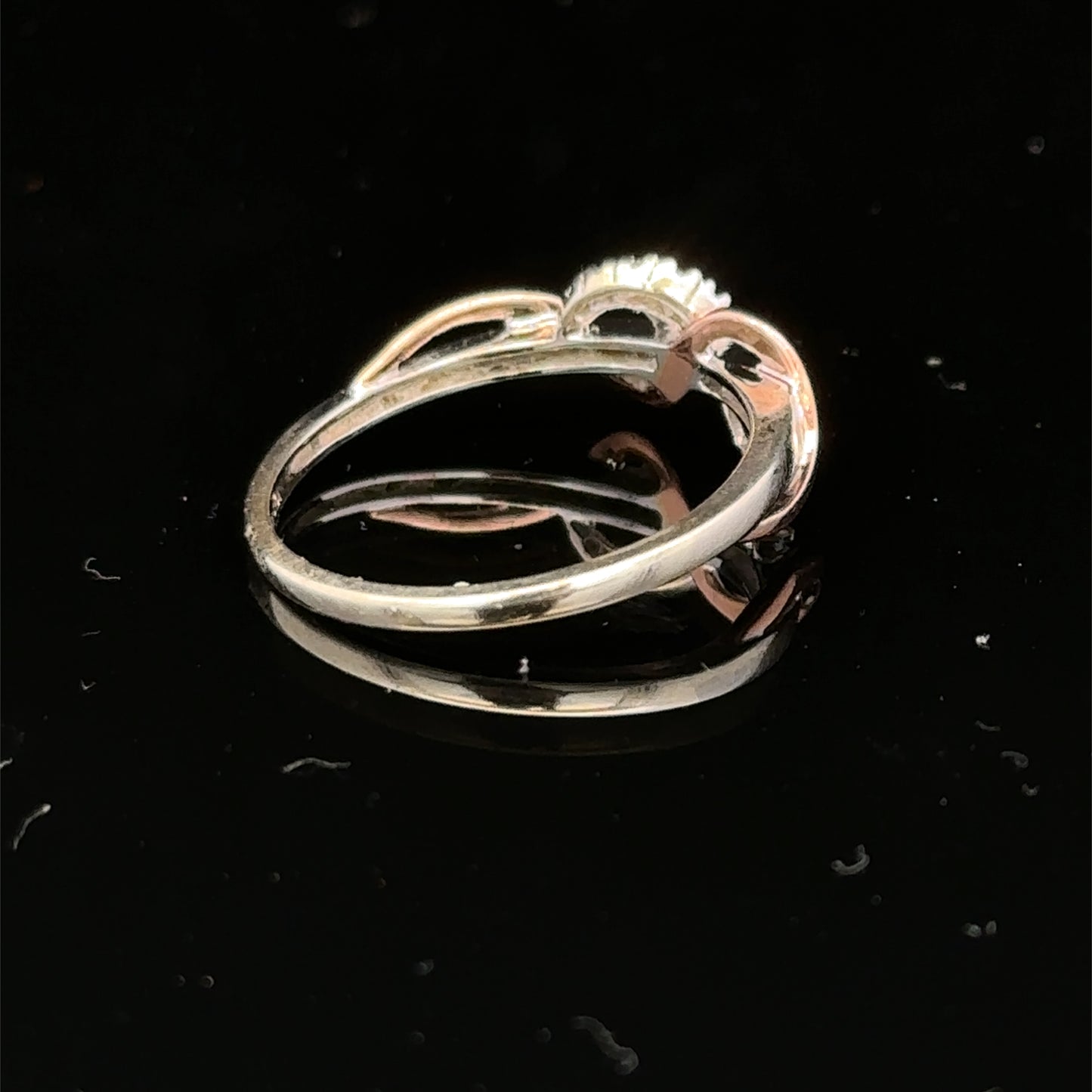 9ct white gold diamond ring size M by Reeves and Sons, featuring sparkling diamonds set in a sleek band.