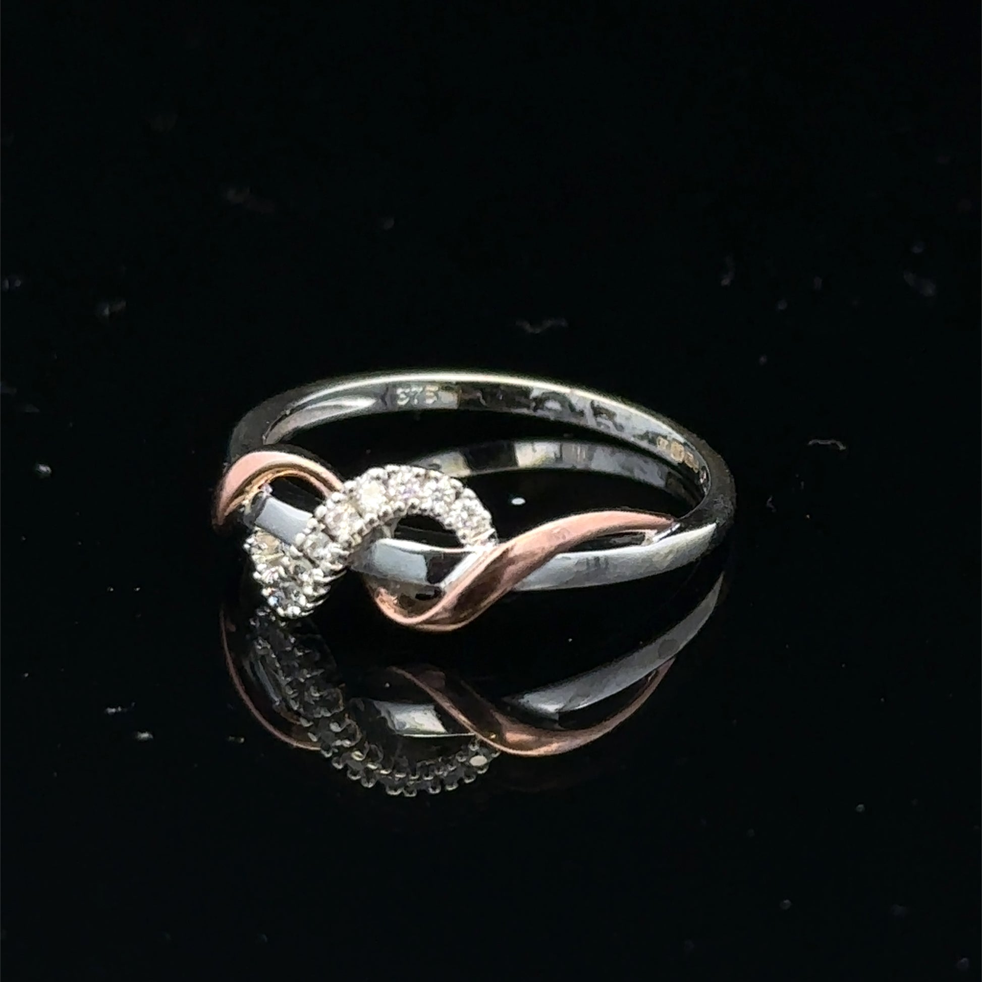 9ct white gold diamond ring in size M with sparkling diamonds, crafted by Reeves and Sons.