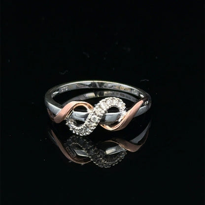 9ct white gold diamond ring in size M with sparkling diamonds, featuring a sleek design from Reeves and Sons.