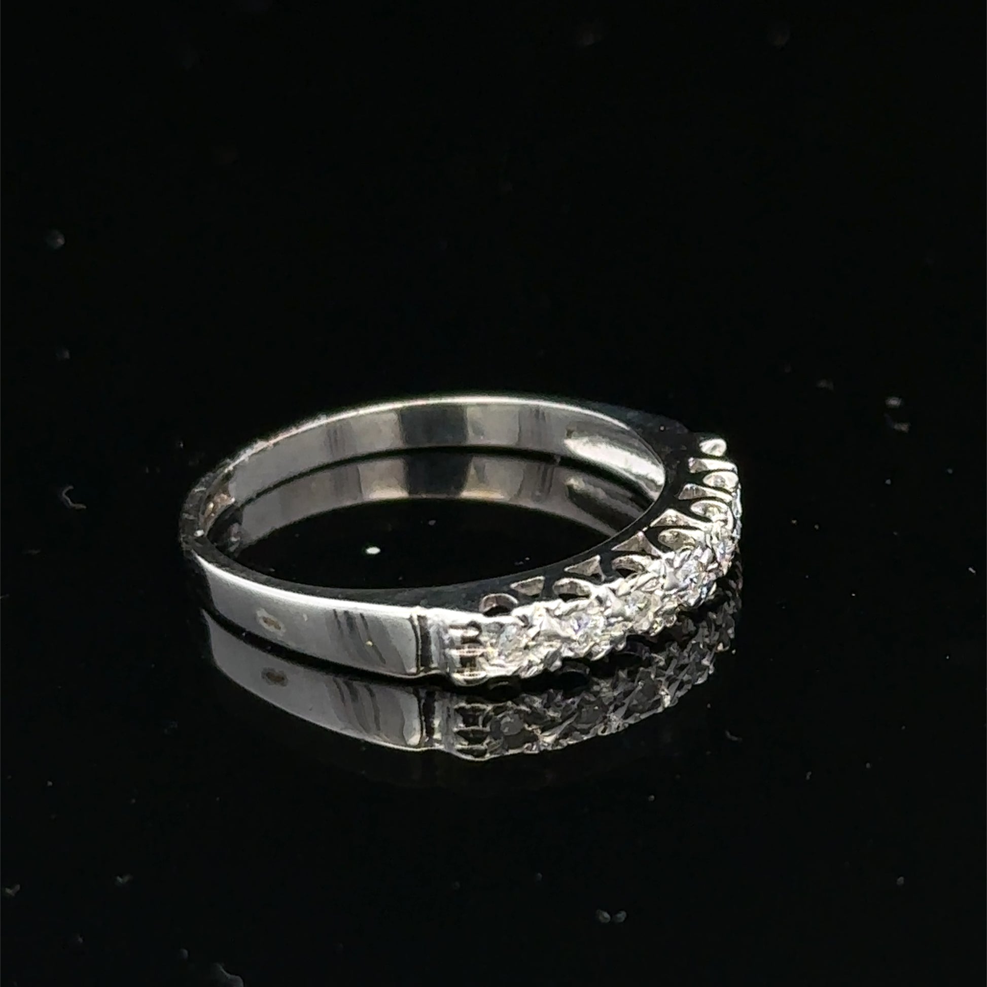 9ct white gold diamond ring in size O with sparkling diamonds, crafted by Reeves and Sons, displayed on a white background.
