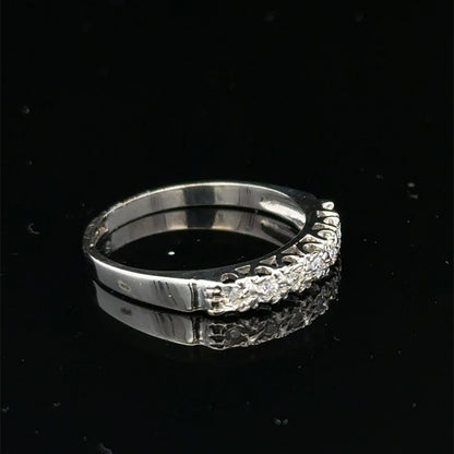 9ct white gold diamond ring in size O with sparkling diamonds, crafted by Reeves and Sons, displayed on a white background.