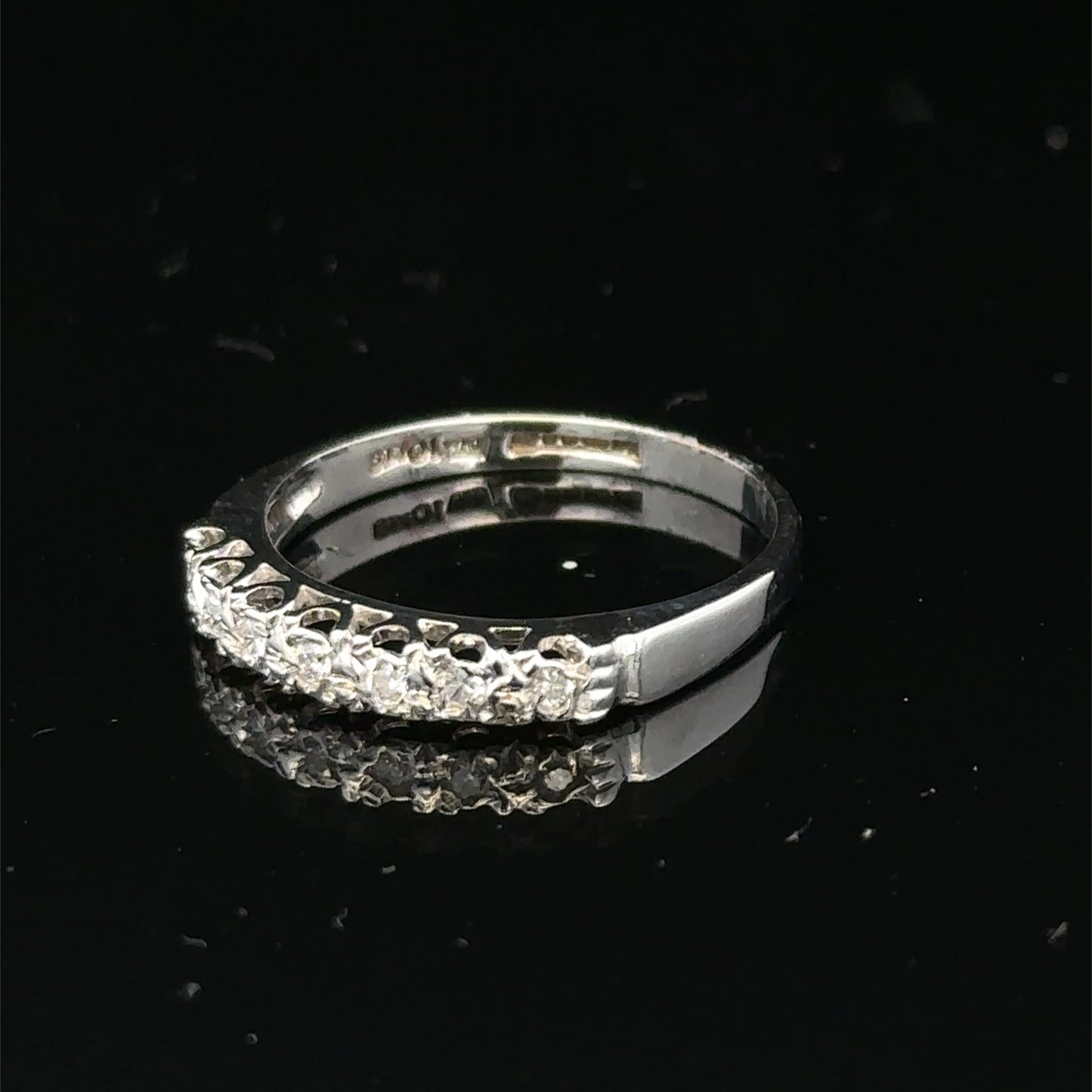 9ct white gold diamond ring in size O with sparkling diamonds, showcasing a elegant and intricate design by Reeves and Sons.
