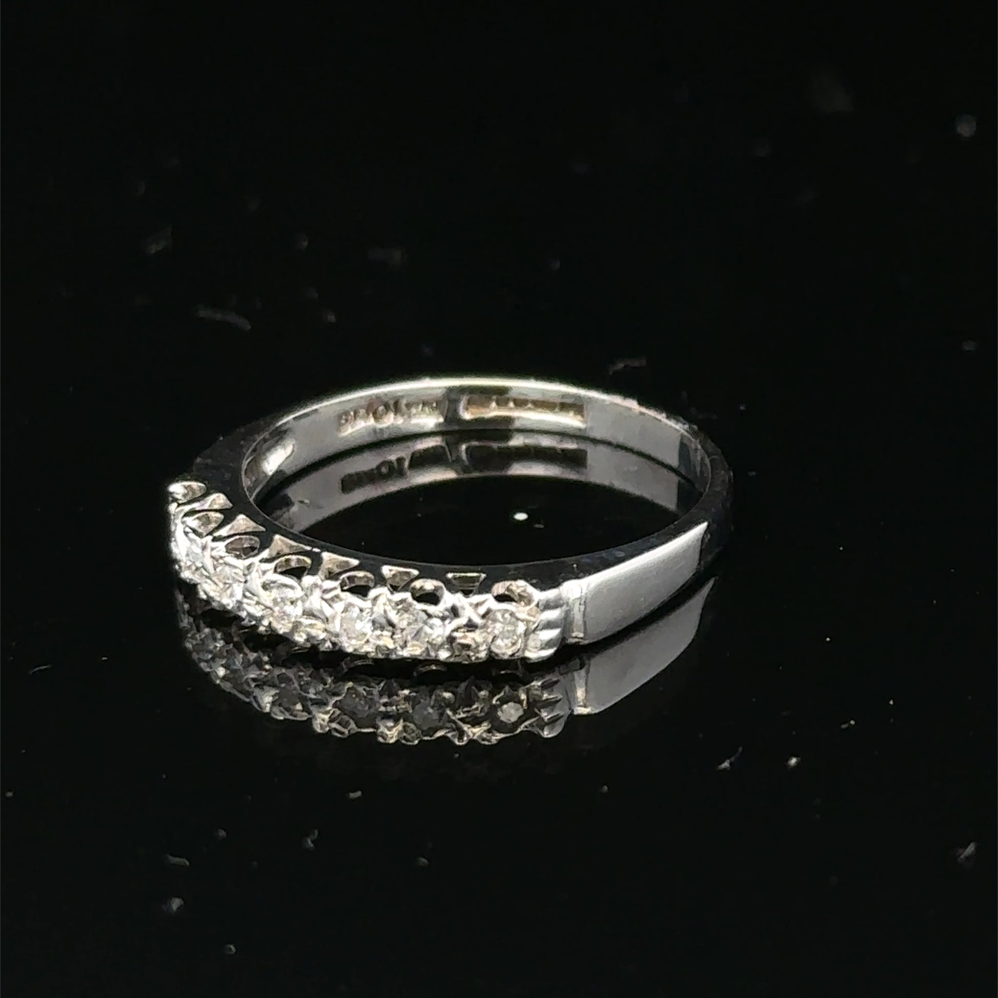 9ct white gold diamond ring in size O with sparkling diamonds, showcasing a elegant and intricate design by Reeves and Sons.
