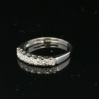 9ct white gold diamond ring in size O with sparkling diamonds, showcasing a elegant and intricate design by Reeves and Sons.