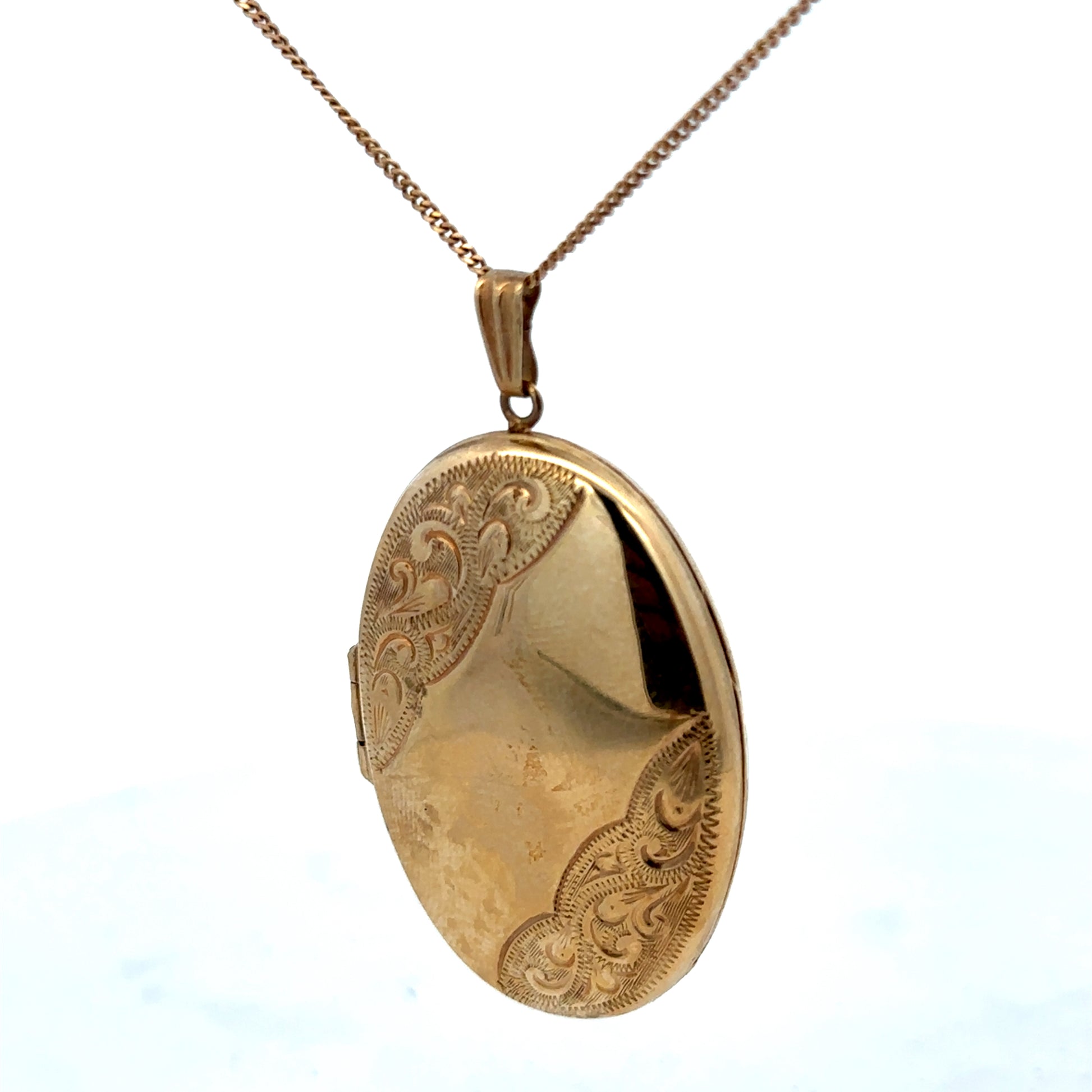 9ct yellow gold locket pendant by Reeves and Sons, 6.6g, featuring a detailed design and polished finish.