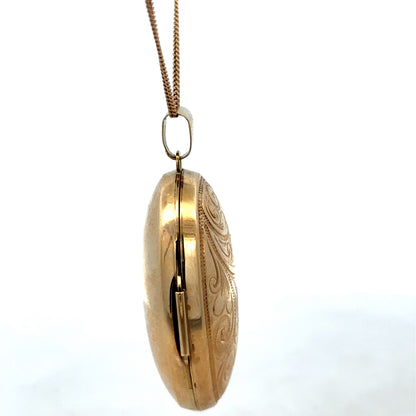 9ct yellow gold locket pendant with a polished finish, weighing 6.3g, by Reeves and Sons, shown in a close-up image.