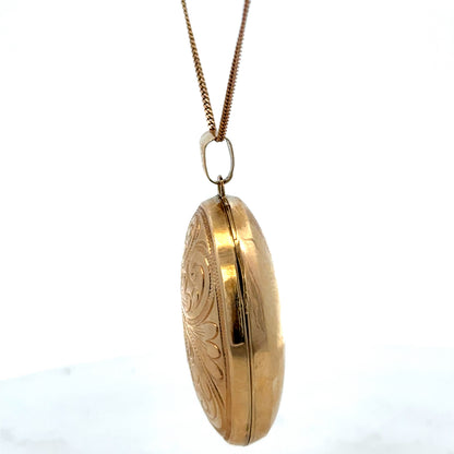 9ct yellow gold locket pendant by Reeves and Sons, 6.3g, featuring intricate design and a polished finish.