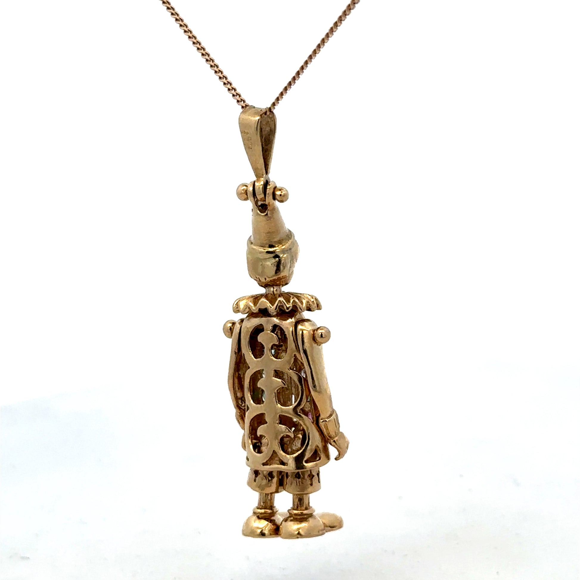 9ct yellow gold clown pendant weighing 8.7g, featuring detailed craftsmanship, from Reeves and Sons.