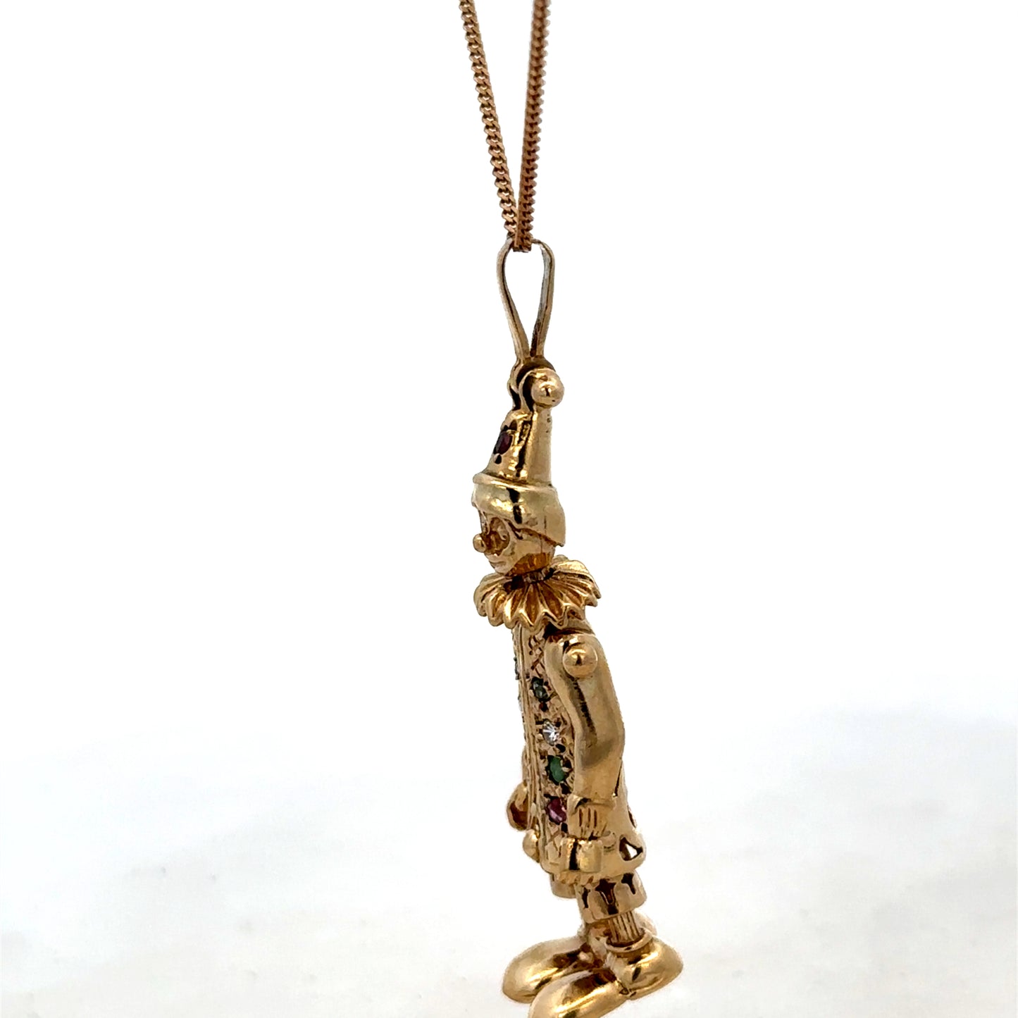 9ct yellow gold clown pendant with detailed face and colorful design, weighs 8.7g, by Reeves and Sons.