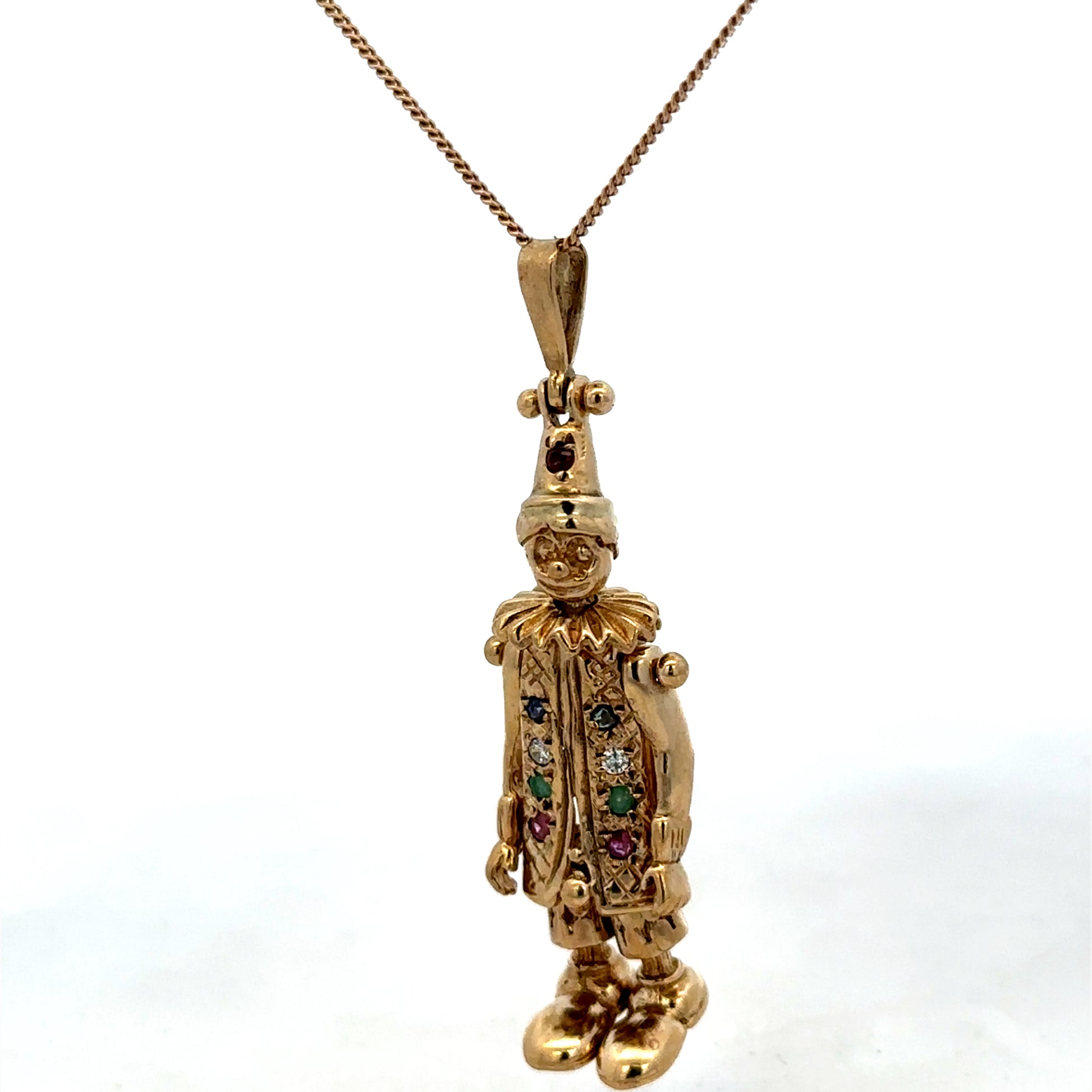9ct yellow gold clown pendant weighing 8.7g, detailed craftmanship, from Reeves and Sons, displayed with vibrant gold finish.