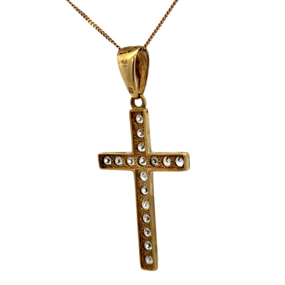 9ct yellow gold cross pendant weighing 4.6g with detailed design, crafted by Reeves and Sons, hanging on a chain.