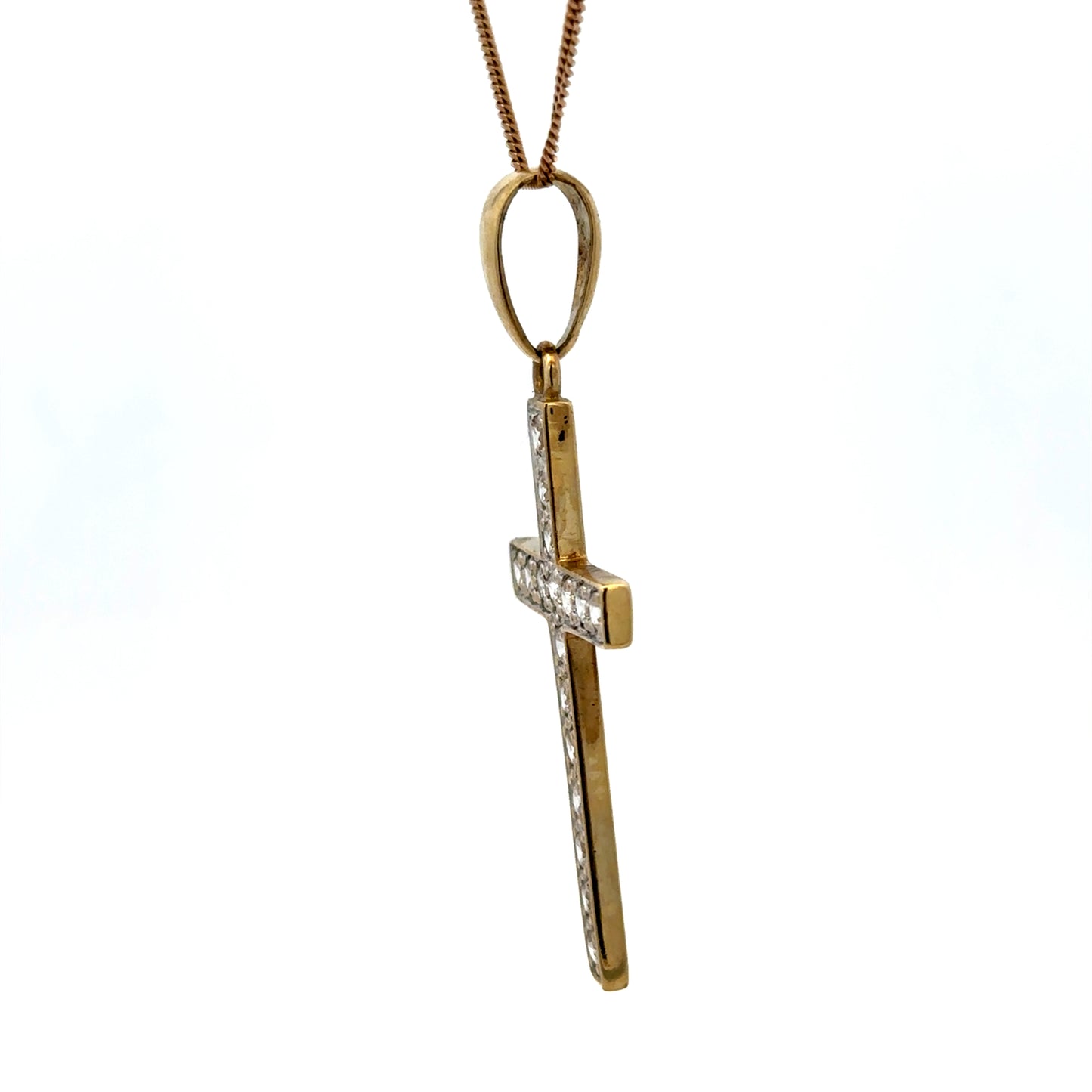 9ct yellow gold cross pendant weighing 4.6g with engraved details, featuring a classic religious jewelry design.