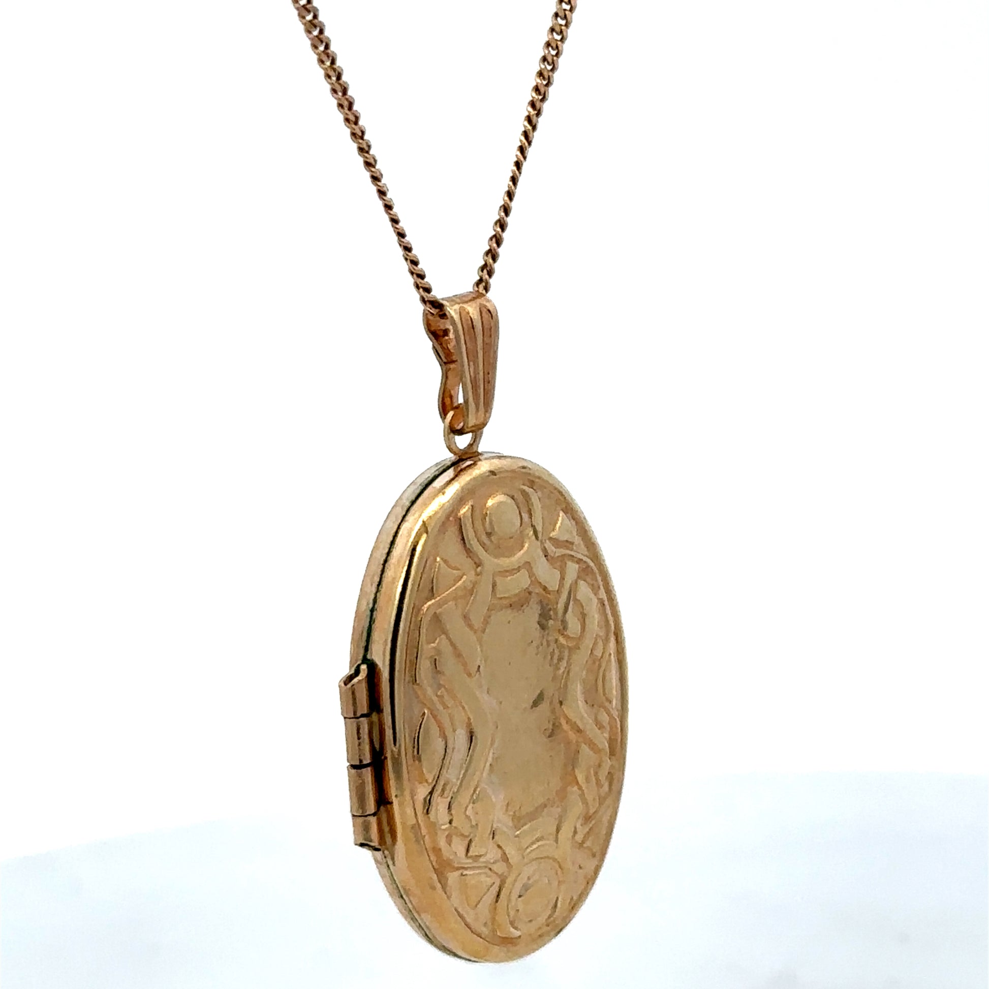 Reeves and Sons 9ct yellow gold pendant locket, 3.4g, featuring a classic design with intricate detailing visible in the image.