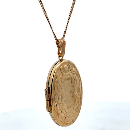 Reeves and Sons 9ct yellow gold pendant locket, 3.4g, featuring a classic design with intricate detailing visible in the image.