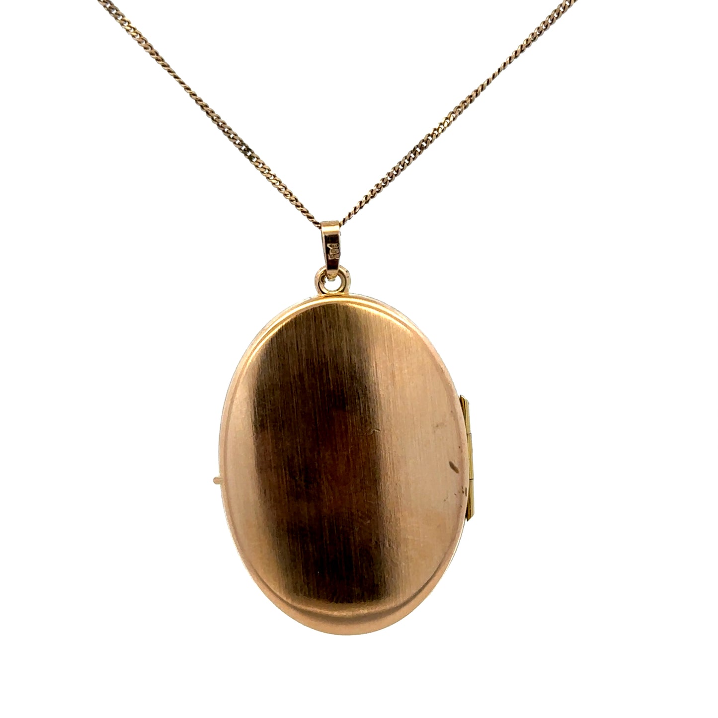 9ct yellow gold locket pendant with floral engraving, weighing 6.7g, by Reeves and Sons, shown with detailed design and polished finish.