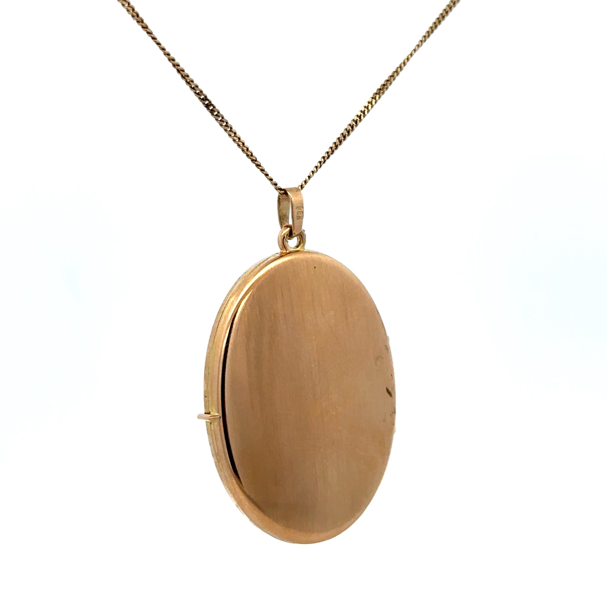 9ct yellow gold locket pendant by Reeves and Sons, weighing 6.7g, featuring a classic design with intricate detailing.