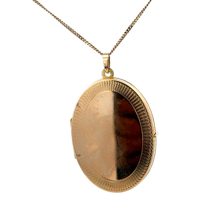 9ct yellow gold locket pendant by Reeves and Sons, weighing 6.7g, featuring intricate design and polished finish.