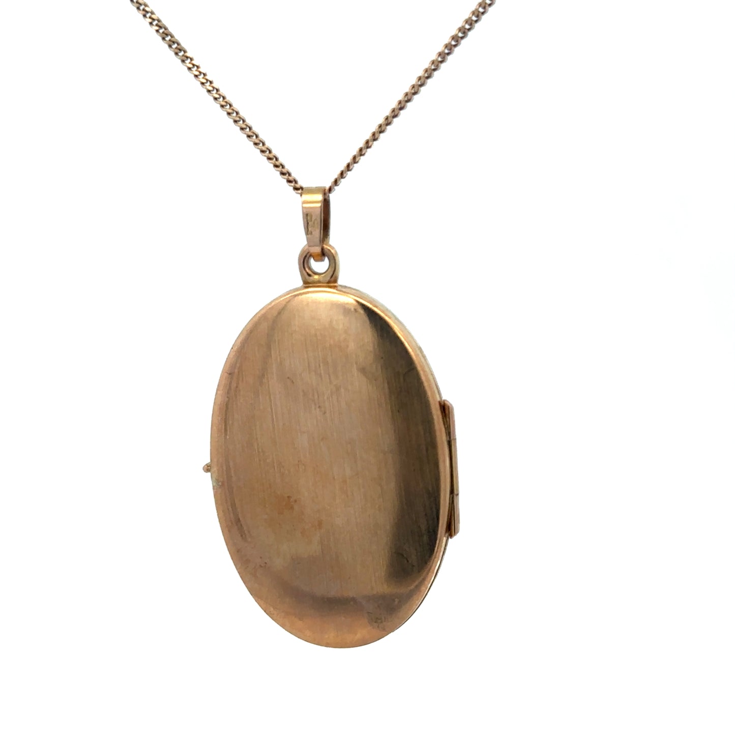 9ct yellow gold locket pendant with intricate design, weighing 4.7g, by Reeves and Sons.