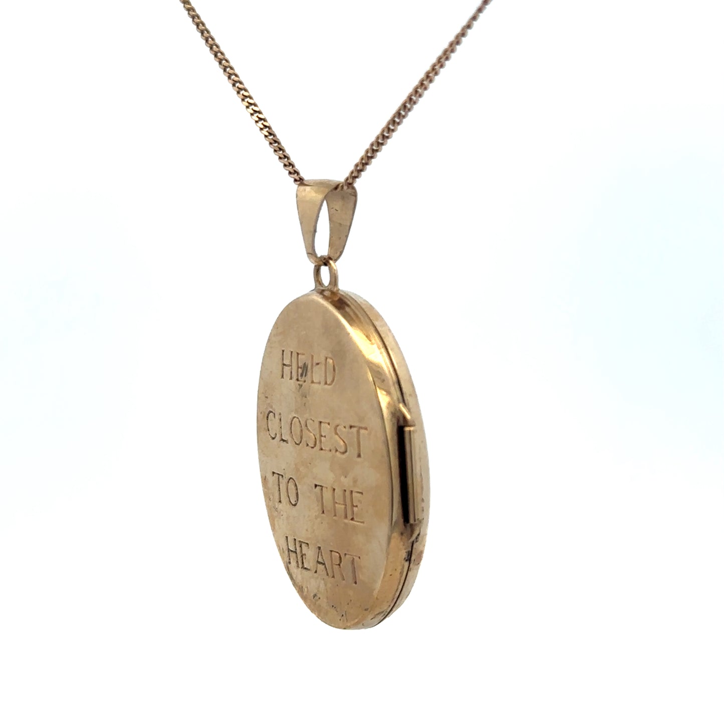 9ct yellow gold locket pendant by Reeves and Sons, weighing 5.8g, featuring a classic design with a smooth polished surface.