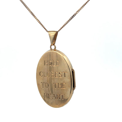 9ct yellow gold locket pendant with intricate detailing, weighing 5.8g, from Reeves and Sons.