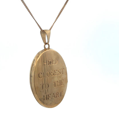 9ct yellow gold locket pendant by Reeves and Sons, showcasing a polished, classic design with a secure clasp and smooth finish.