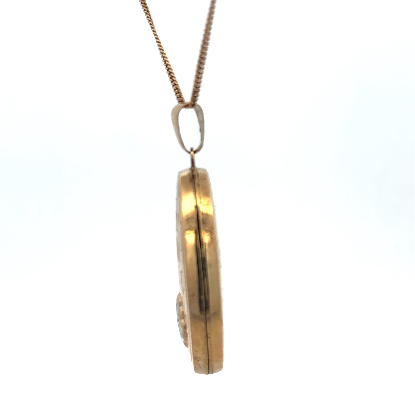 9ct yellow gold locket pendant by Reeves and Sons, weight 5.8g, featuring a detailed design and polished finish.