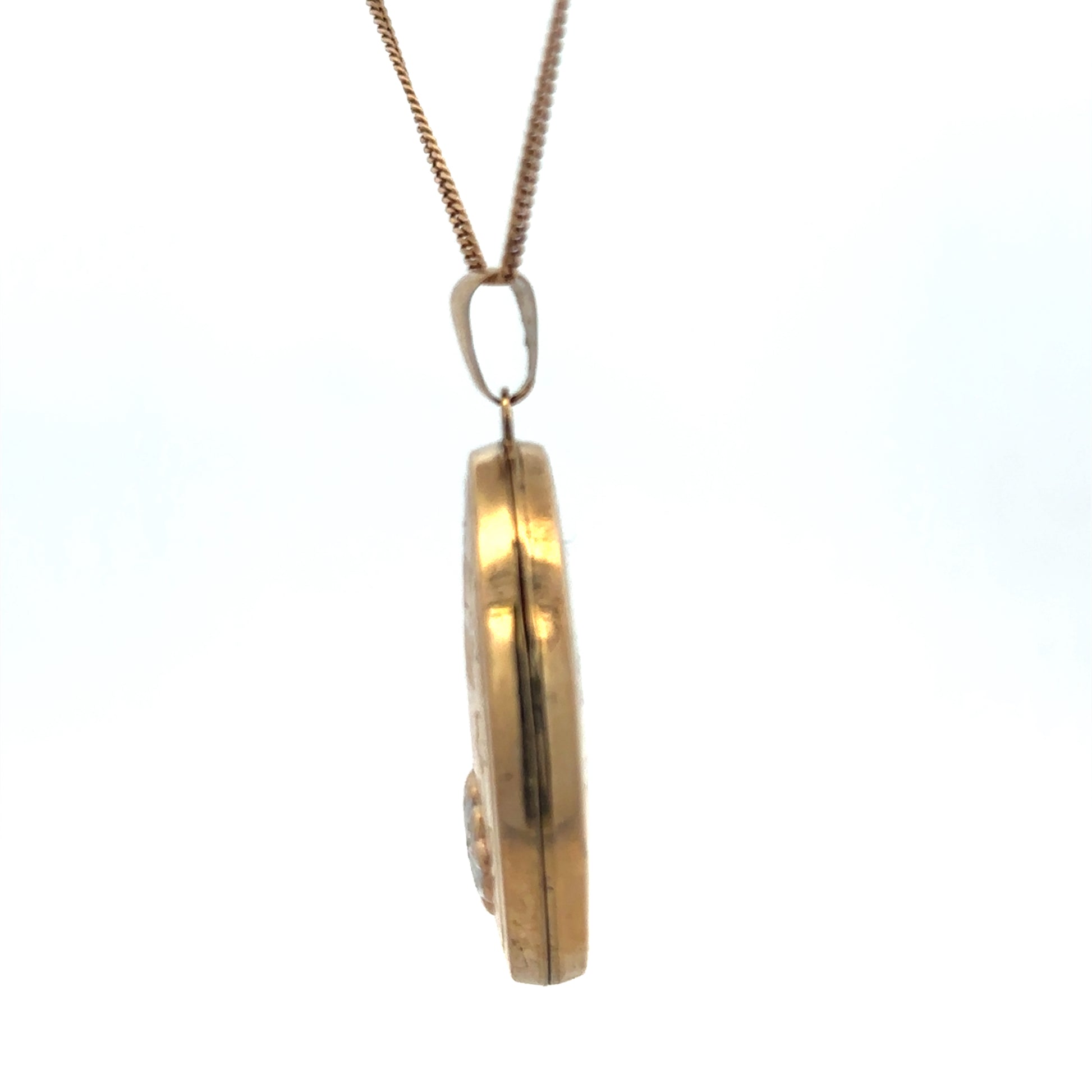 9ct yellow gold locket pendant by Reeves and Sons, weight 5.8g, featuring a detailed design and polished finish.