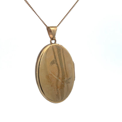 9ct yellow gold locket pendant with intricate design, weighing 4.2g, by Reeves and Sons, detailed close-up image.