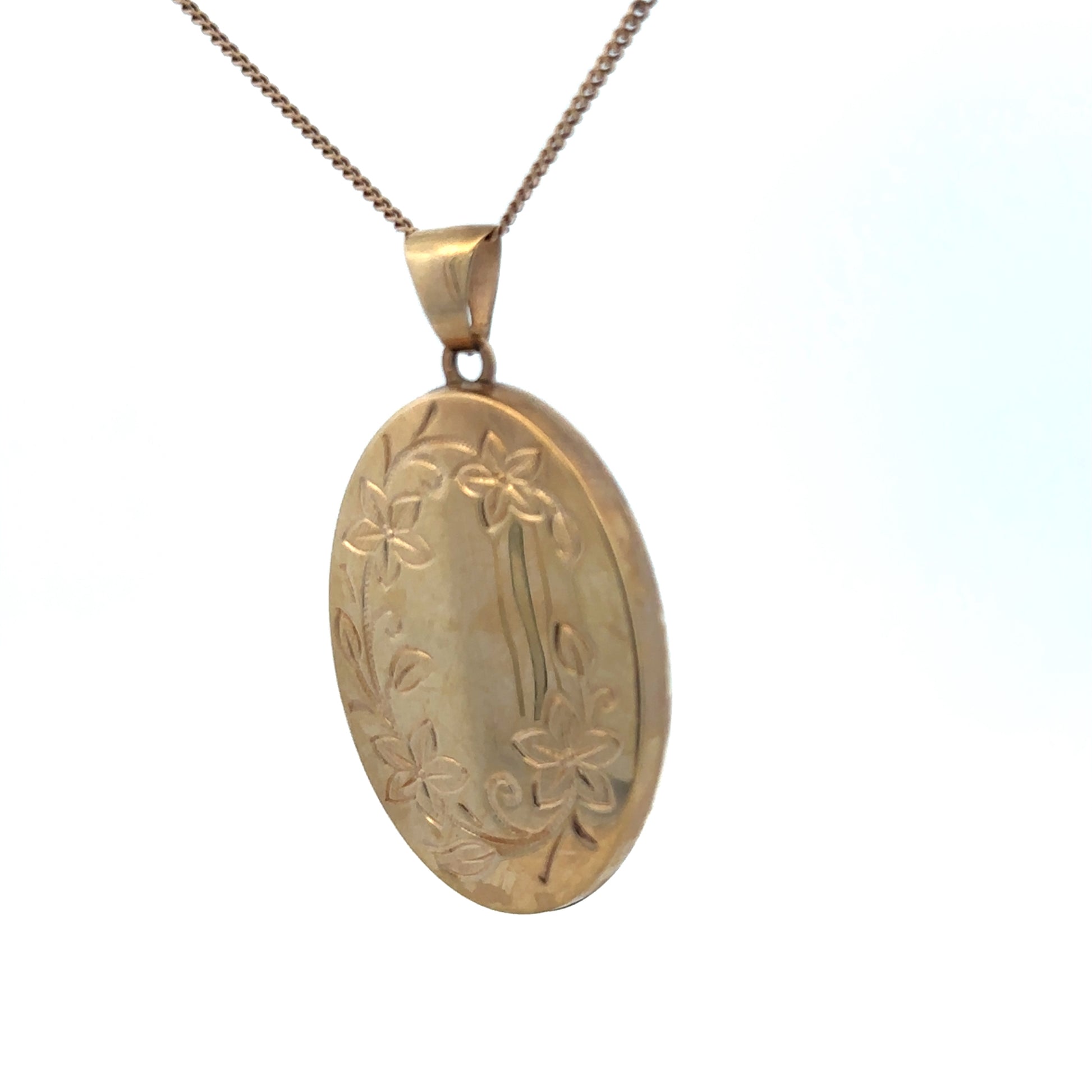 9ct yellow gold locket pendant by Reeves and Sons, 4.2g, featuring a smooth polished surface and classic design.