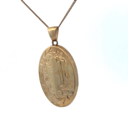 9ct yellow gold locket pendant by Reeves and Sons, 4.2g, featuring a smooth polished surface and classic design.