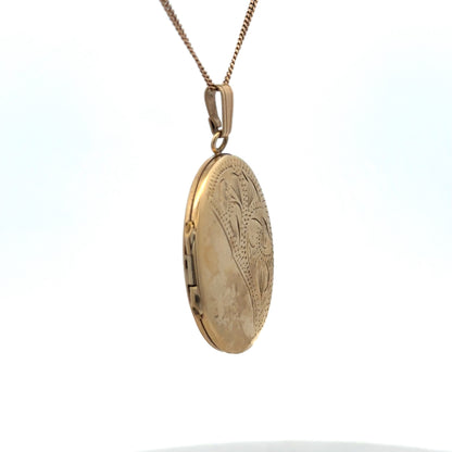 9ct yellow gold locket pendant by Reeves and Sons, 5.4g, featuring a classic design with intricate detailing.