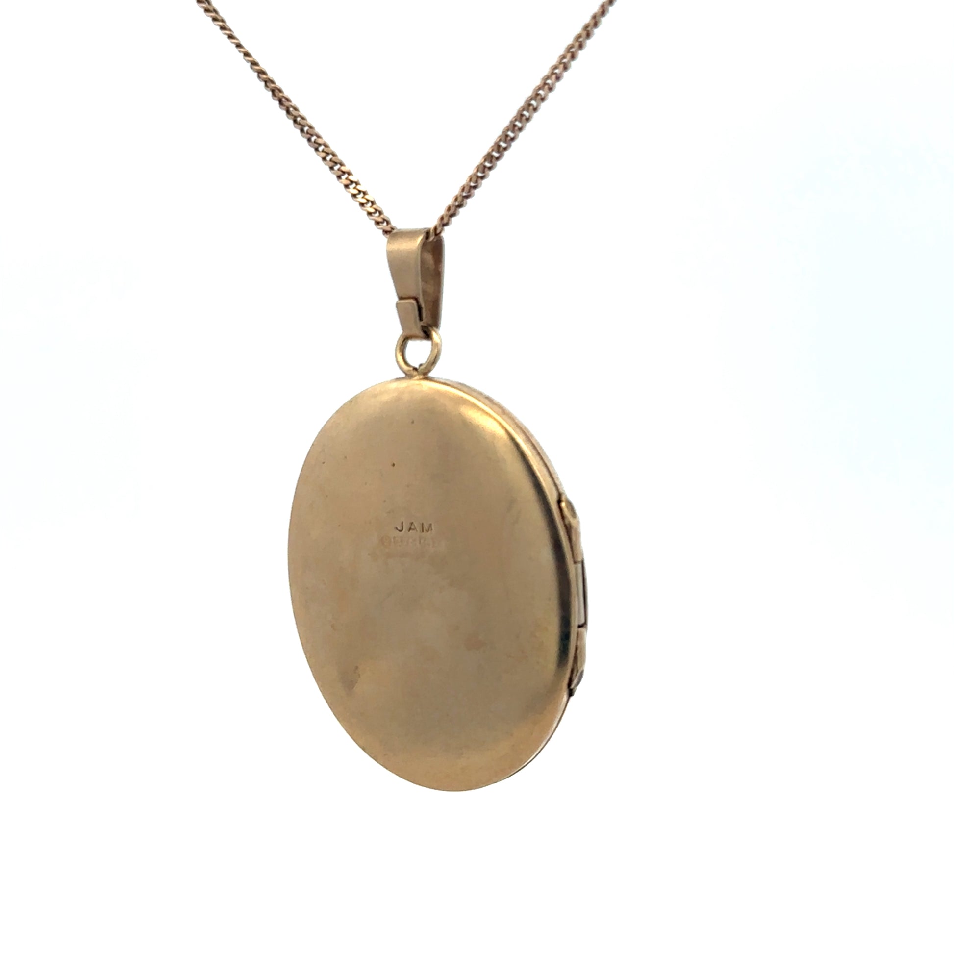 9ct yellow gold locket pendant with engraved detailing, weighing 5.4g, by Reeves and Sons, shown close-up with intricate design.