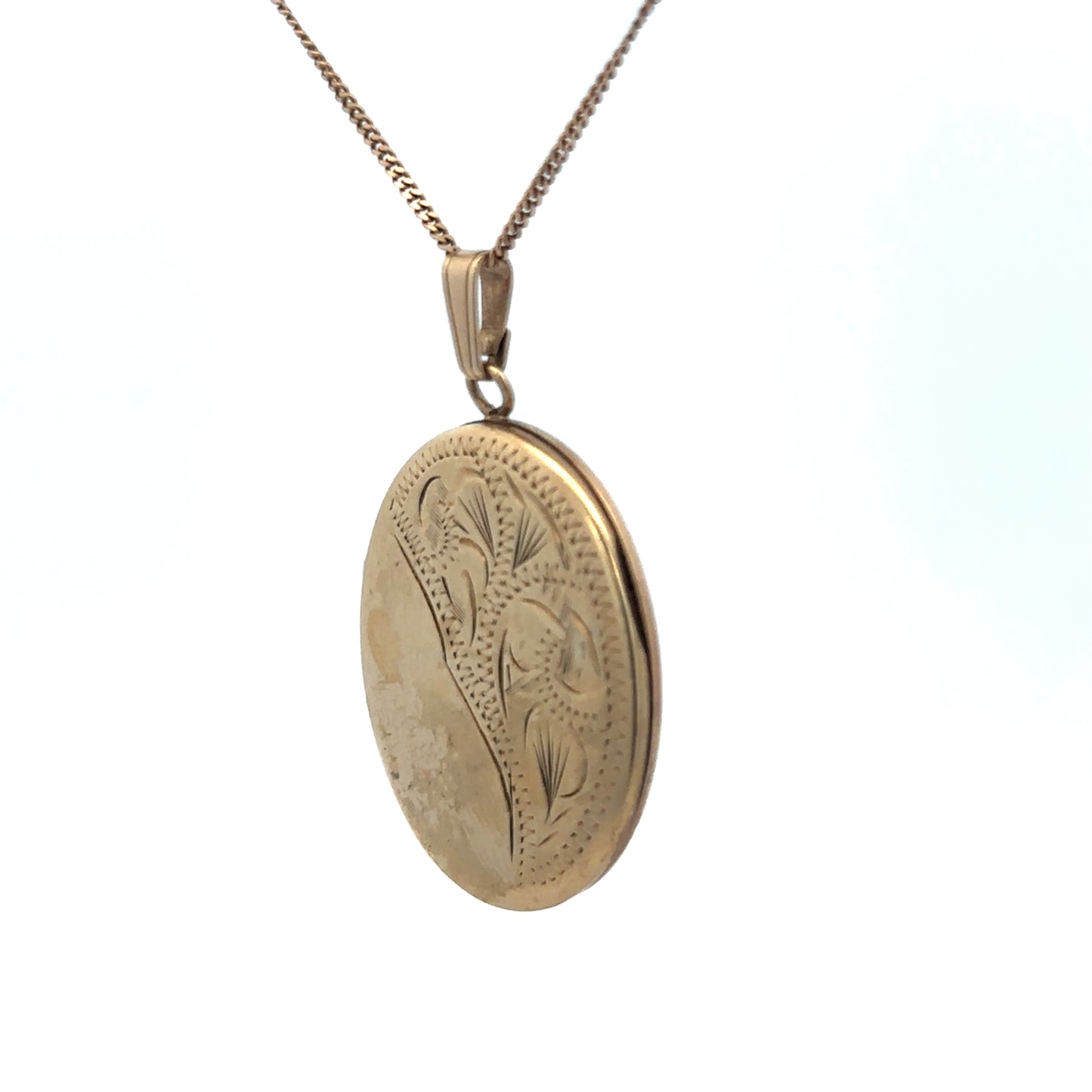 9ct yellow gold locket pendant with floral engraving, Reeves and Sons, showing intricate design and polished finish.