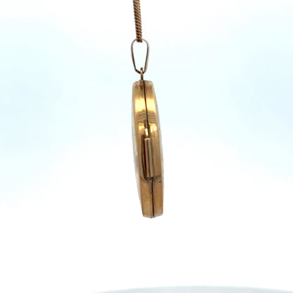 9ct yellow gold locket pendant by Reeves and Sons, 4.4g, featuring intricate design and polished finish.