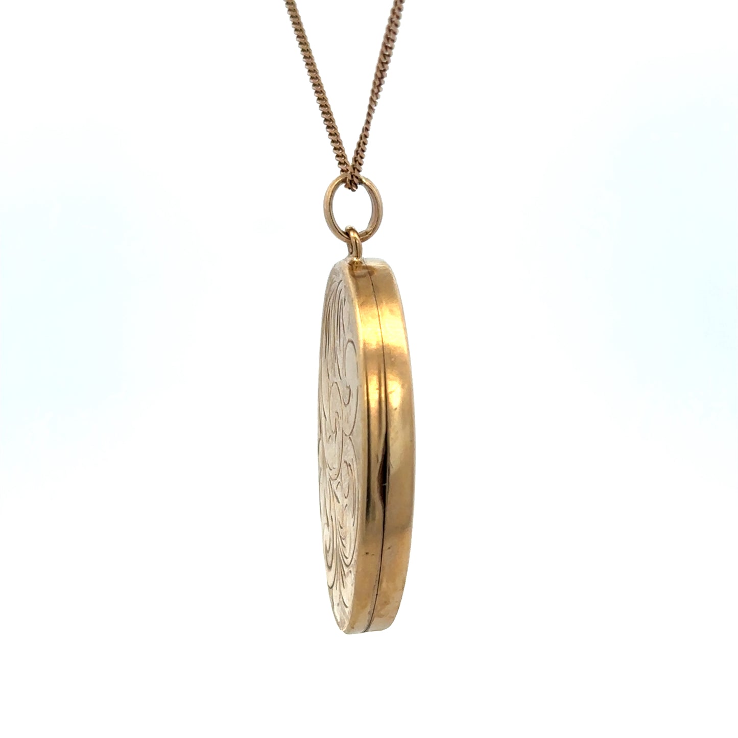 9ct yellow gold locket pendant by Reeves and Sons, showcasing a polished oval design with intricate detailing.
