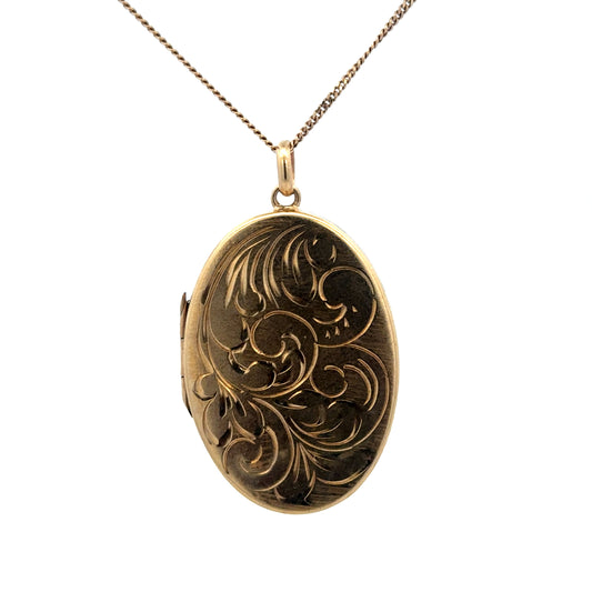 9ct yellow gold locket pendant with intricate design, weighing 9.3g, by Reeves and Sons, shown in detailed close-up image.