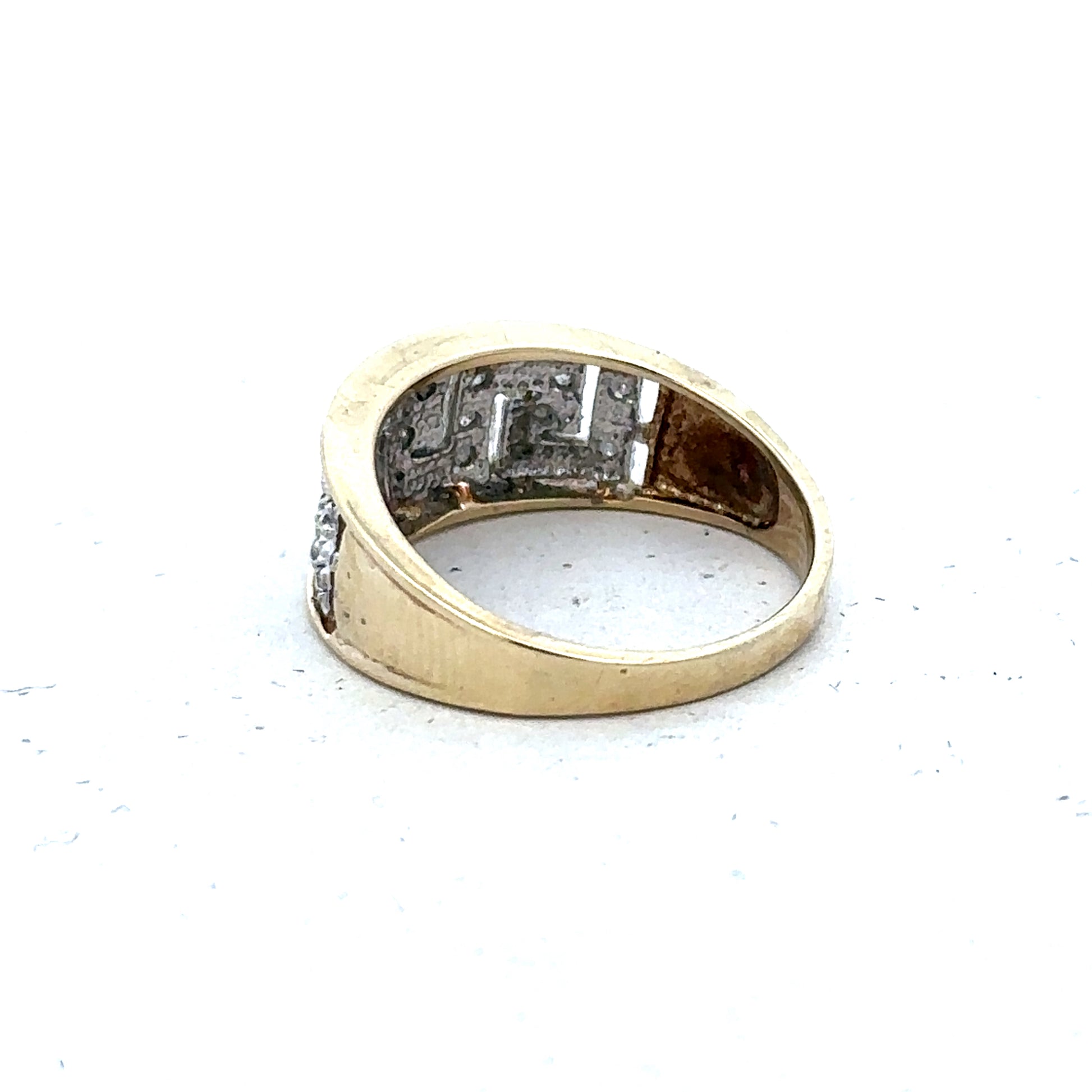 9ct yellow gold diamond ring in size O with intricate band design, crafted by Reeves and Sons.