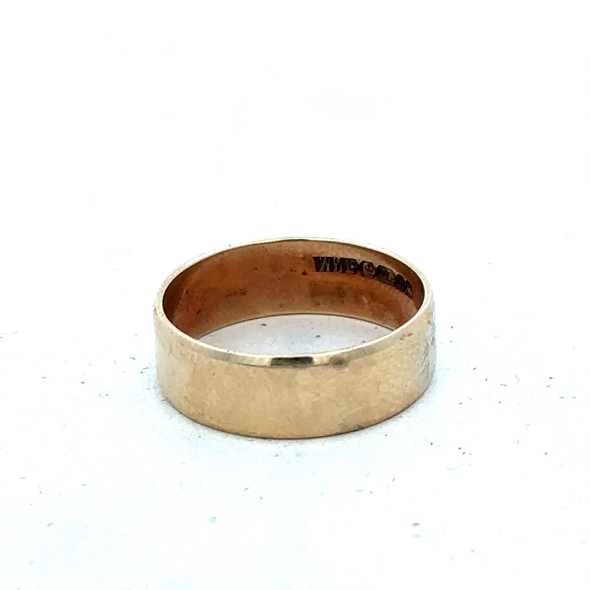 9ct yellow gold band ring in size P1/2 with a smooth polished finish, crafted by Reeves and Sons.