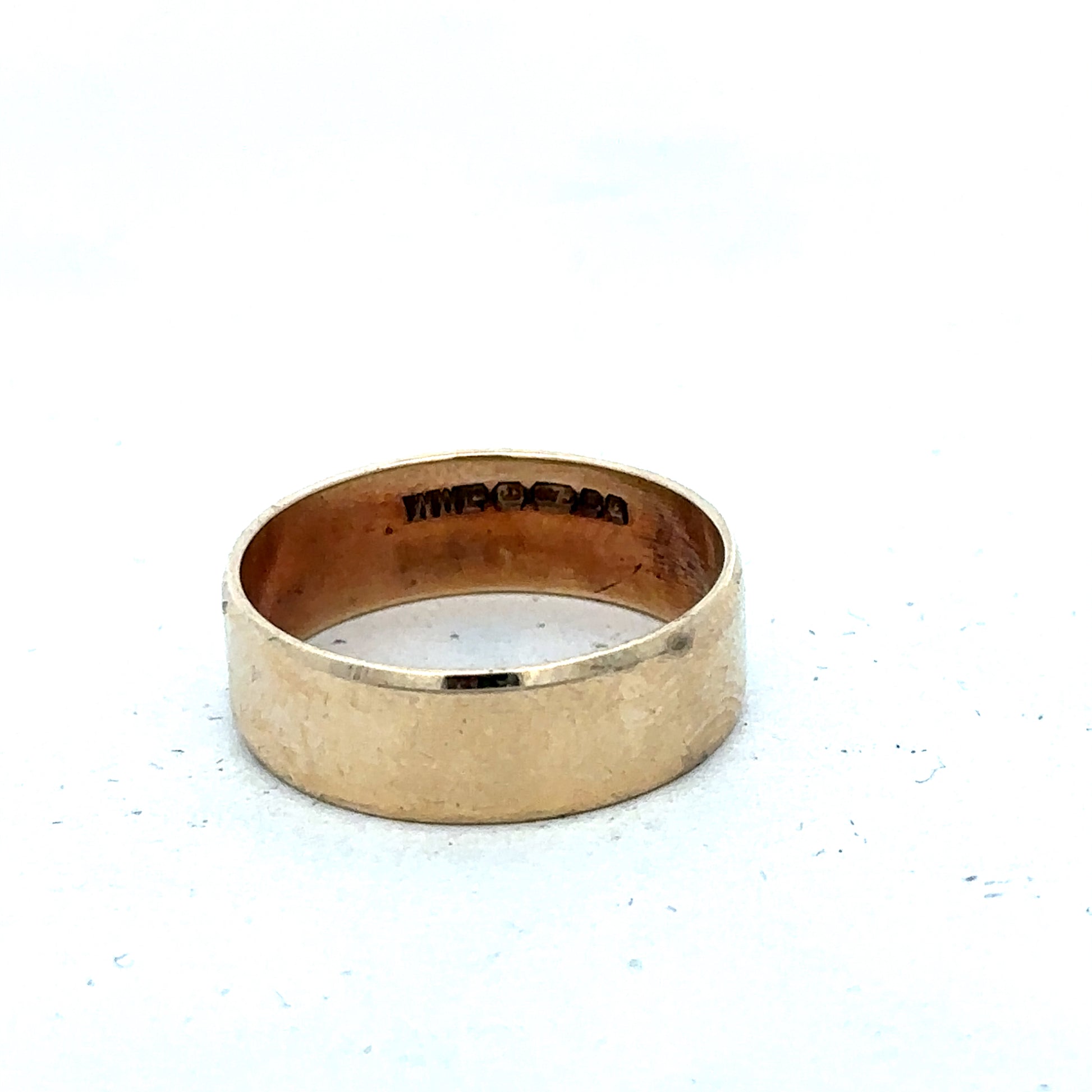9ct yellow gold band ring in size P1/2, smooth polished surface, from Reeves and Sons.