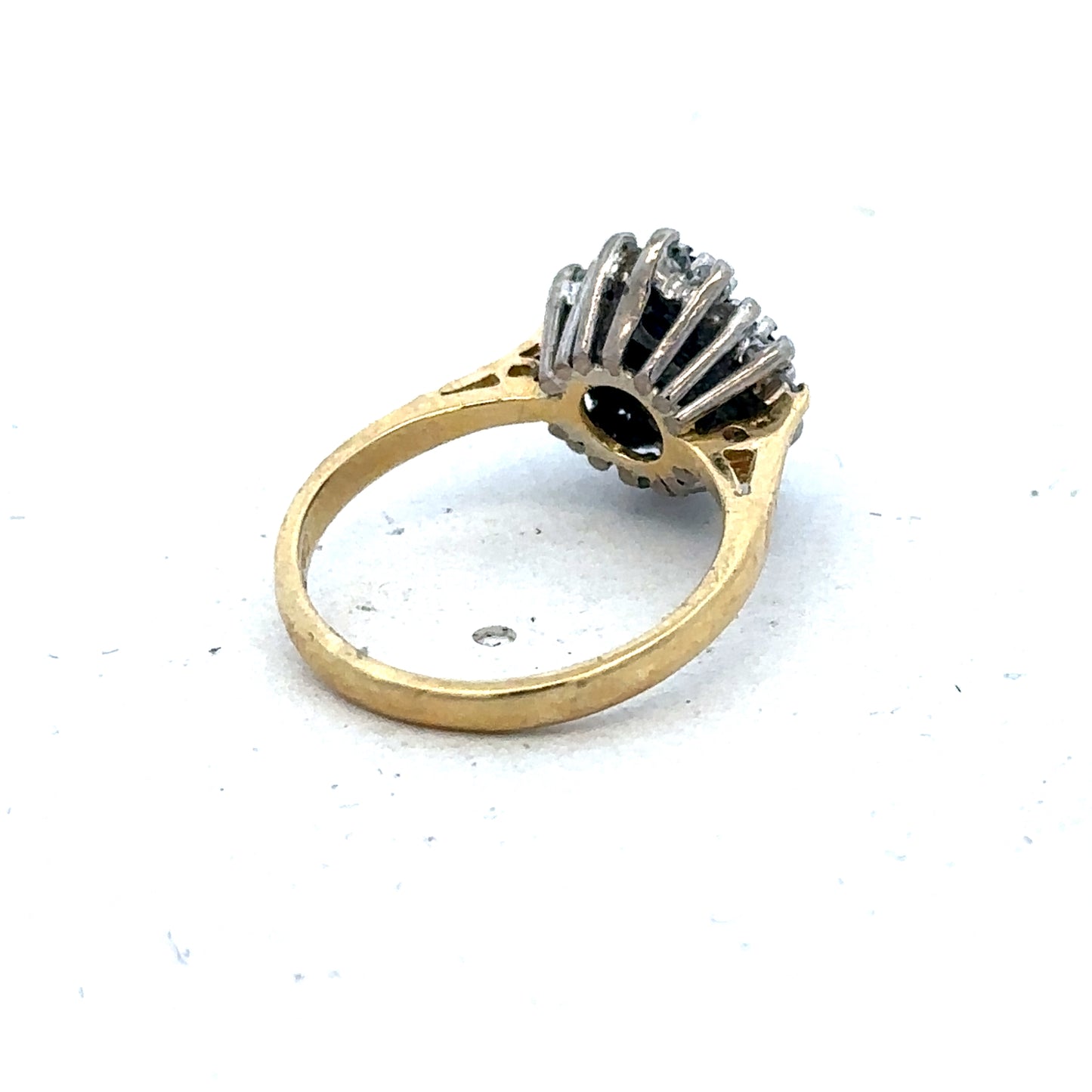 18ct yellow gold diamond and sapphire ring in size H with intricate detailing, from Reeves and Sons.