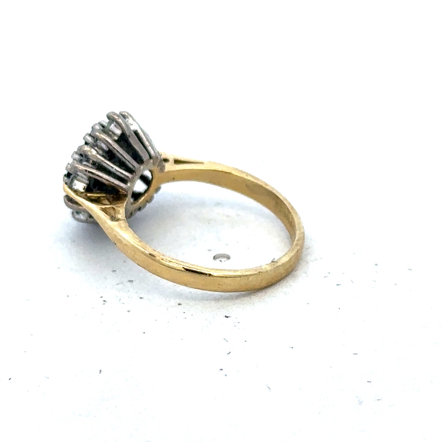 18ct yellow gold diamond and sapphire ring by Reeves and Sons, size H, featuring a sparkling gemstone design.