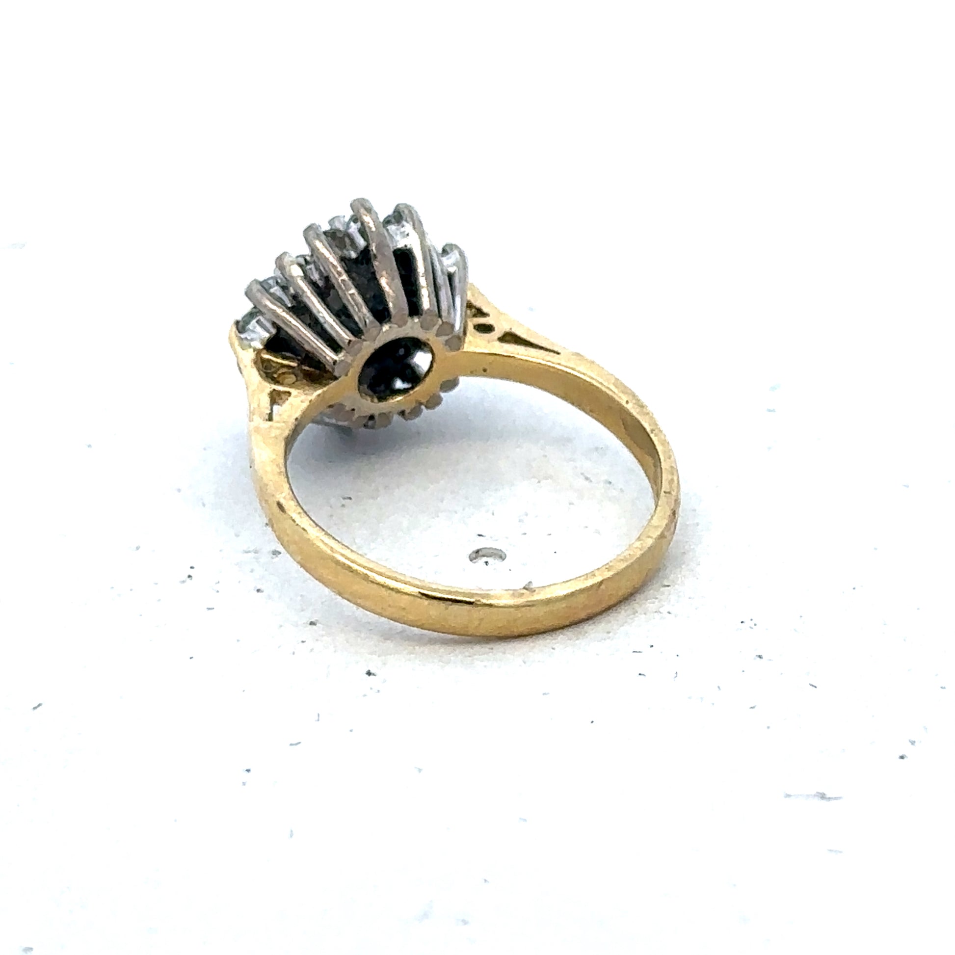 18ct yellow gold diamond and sapphire ring with a size H, featuring a detailed design by Reeves and Sons.