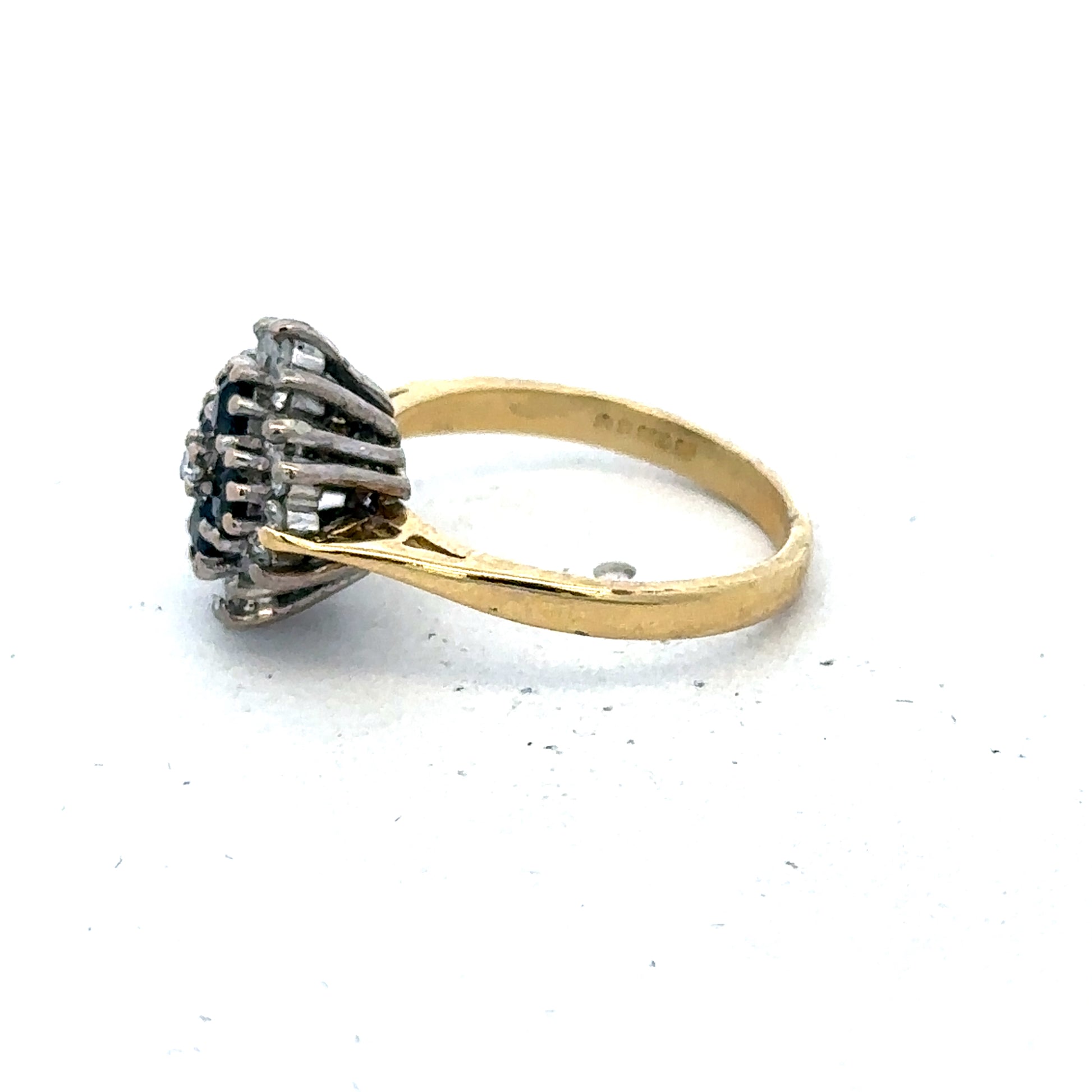 18ct yellow gold ring with diamonds and sapphires, size H, by Reeves and Sons, featuring intricate gemstone settings.