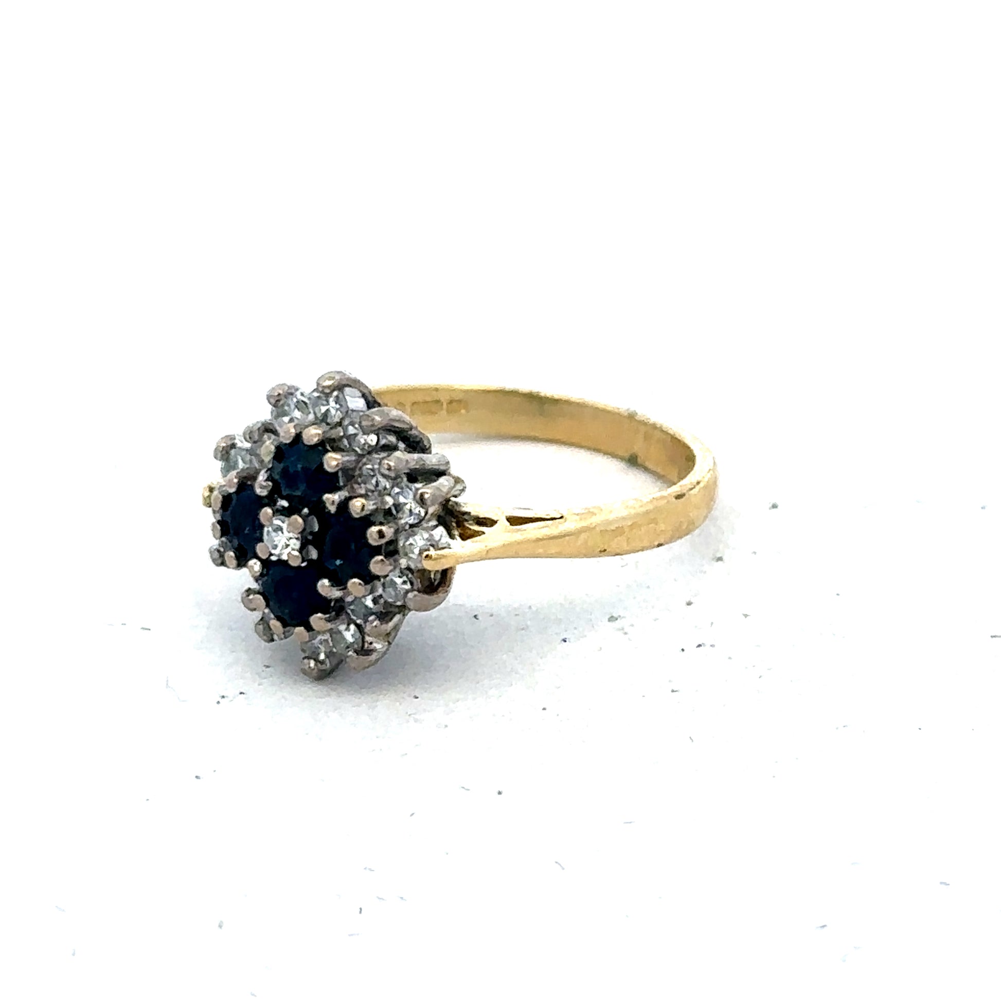 18ct yellow gold ring with diamonds and sapphires, size H, by Reeves and Sons, featuring a detailed gemstone design.