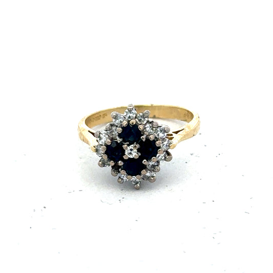 18ct yellow gold diamond and sapphire ring in size H with intricate design, by Reeves and Sons.
