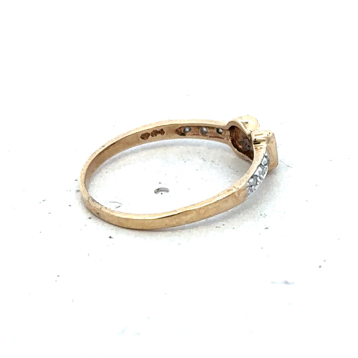 9ct yellow gold buckle ring in size M 1/2, featuring a textured buckle design, by Reeves and Sons.