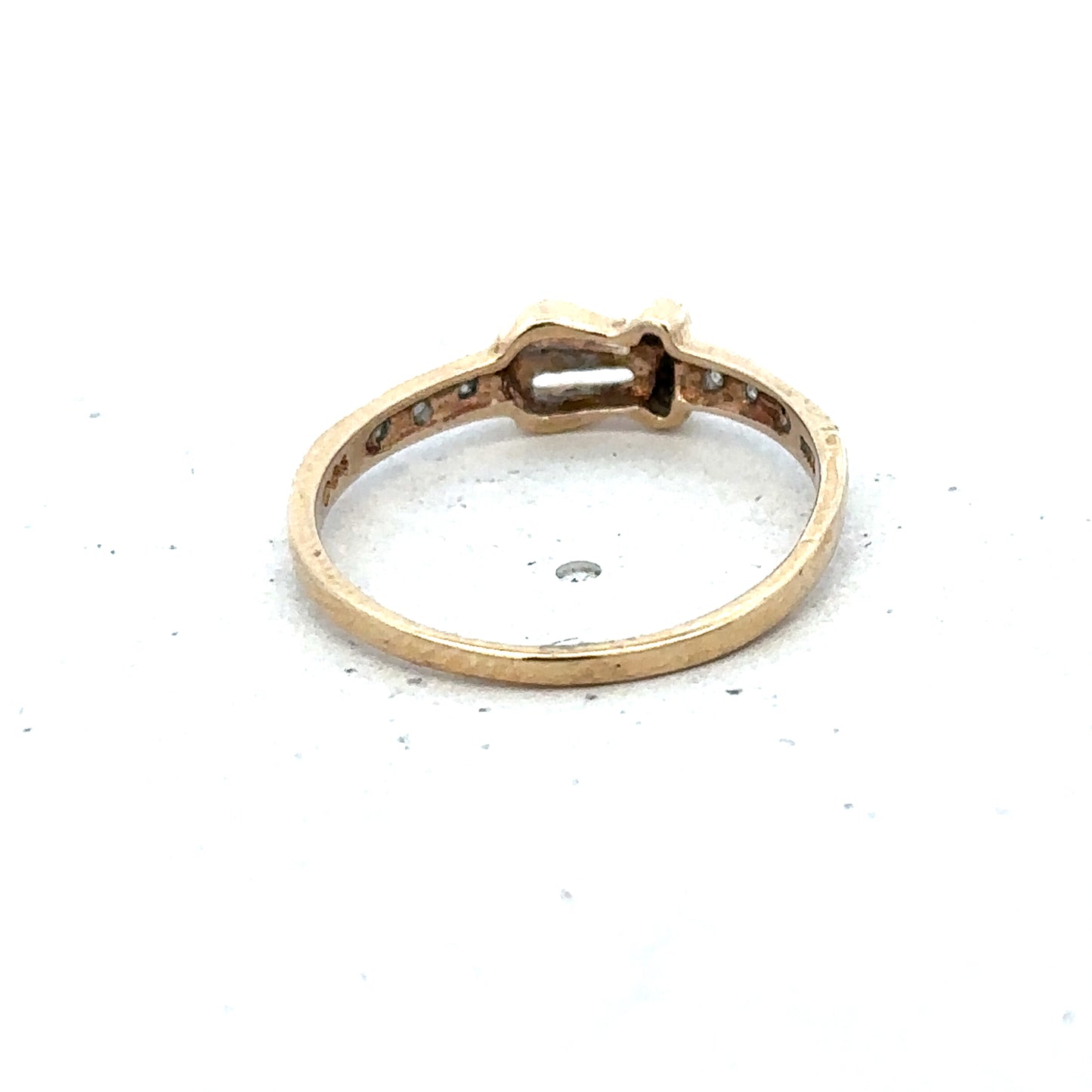 9ct yellow gold buckle ring in size M 1/2, featuring a polished gold band with a distinctive buckle detail.