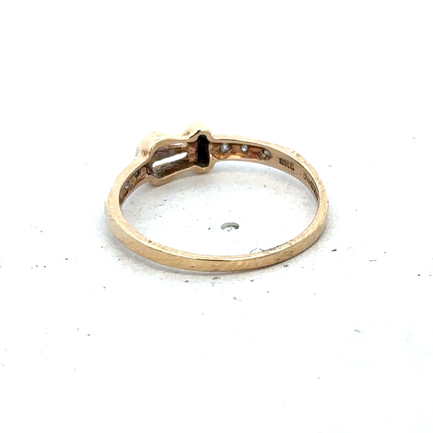 9ct yellow gold buckle ring size M 1/2 with a polished finish, featuring a distinctive buckle design by Reeves and Sons.